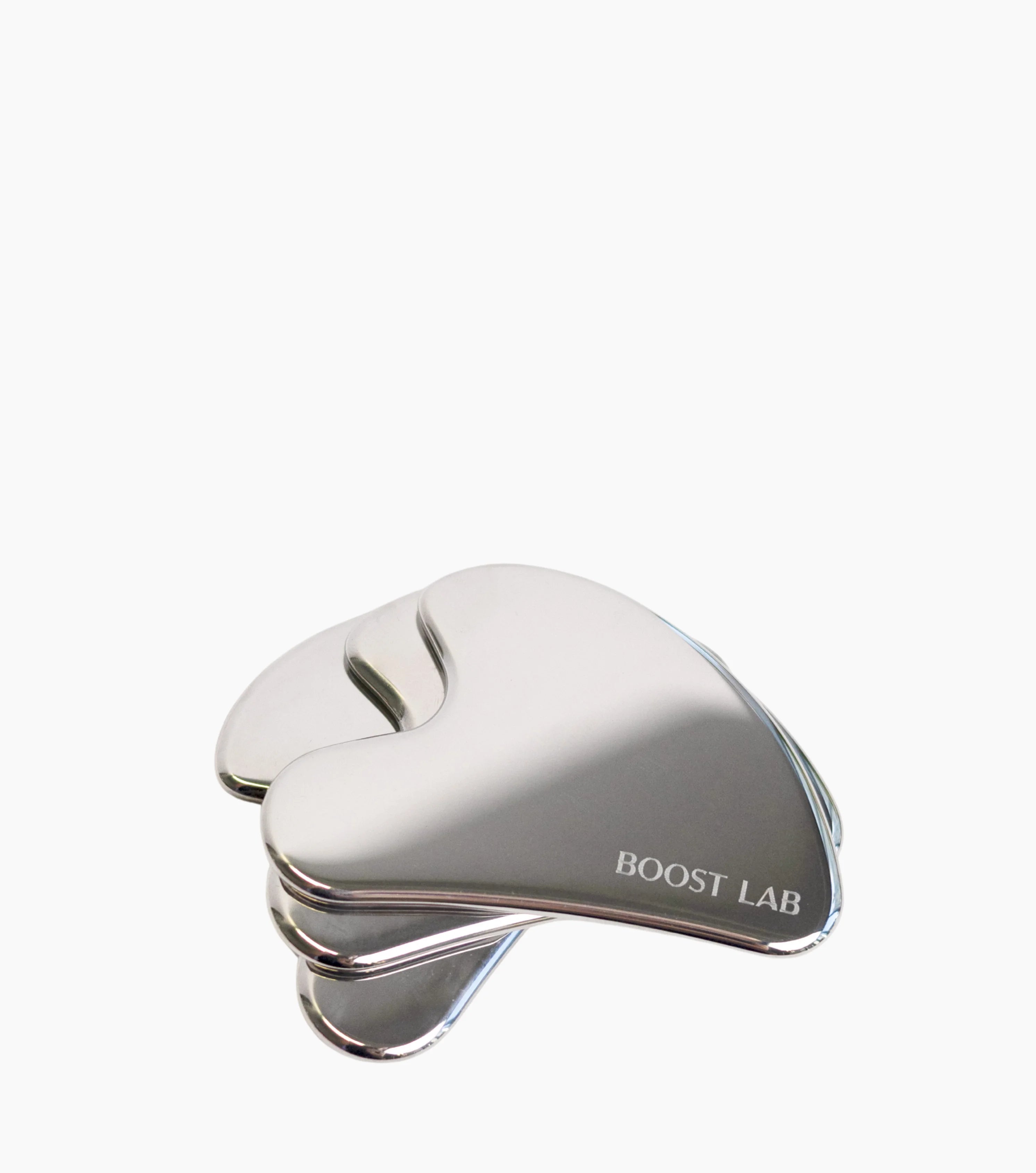 Three metallic silver gua sha facial massage tools stacked together on a clean white background, with the brand name 'BOOST LAB' printed on the side.