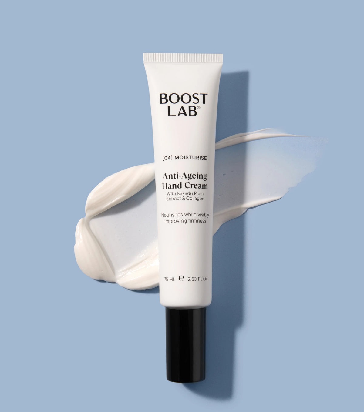 Boost Lab Anti-Ageing Hand Cream tube lying on a blue background beside a swatch of white cream