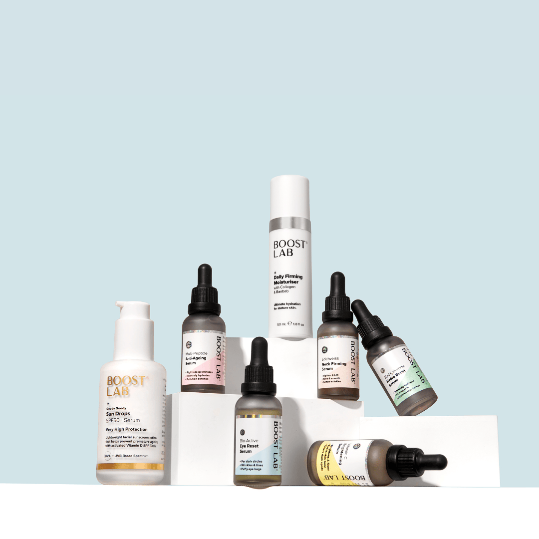 Collection of Boost Lab bottles on a white platform with a light blue background