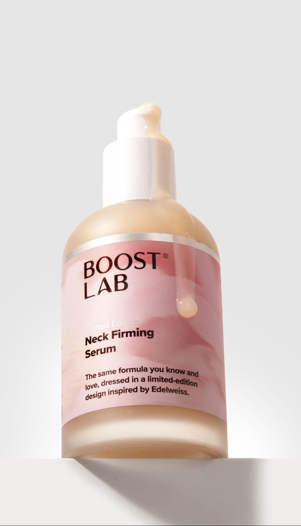 Boost Lab Neck Firming Serum bottle on a light gray background